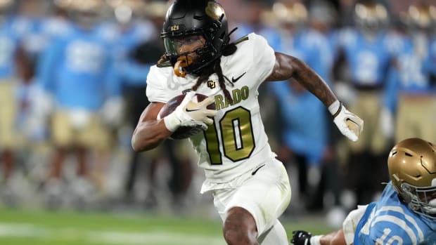 Colorado Buffaloes wide receiver Xavier Weaver (10) carries the ball against the UCLA Bruins in the second half at Rose Bowl. UCLA defeated Colorado 28-16